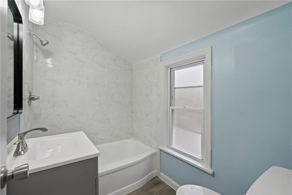 8624 Oakcrest Road Pittsburgh, PA 15235 - Photo 17 of 23 a bathroom with a sink toilet and tub