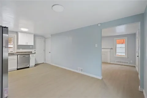 a view of a kitchen with a sink cabinets and a window