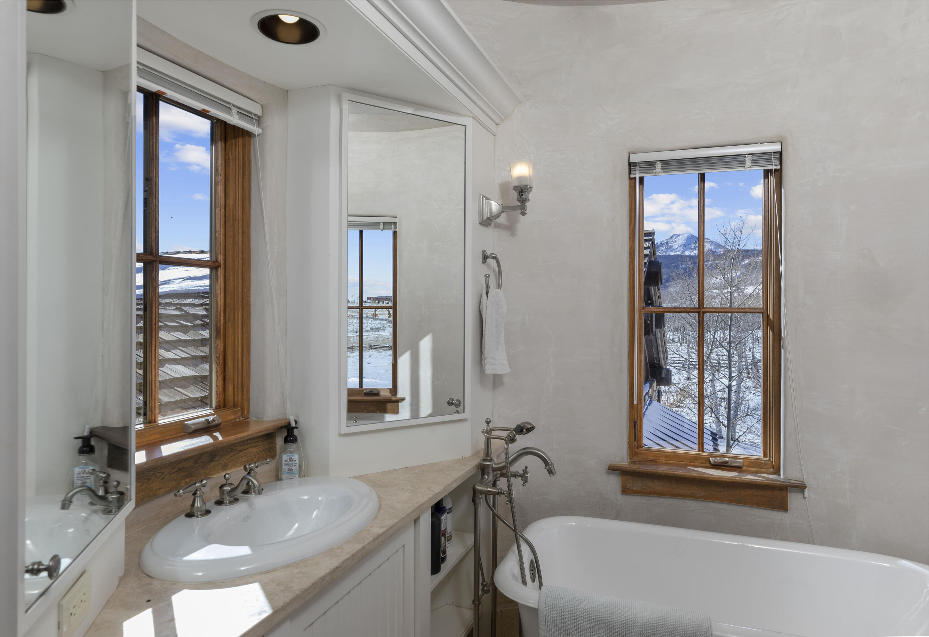 1925 East Anderson Road Placerville, CO 81430 - Photo 13 of 40 a bathroom with a tub sink and mirror