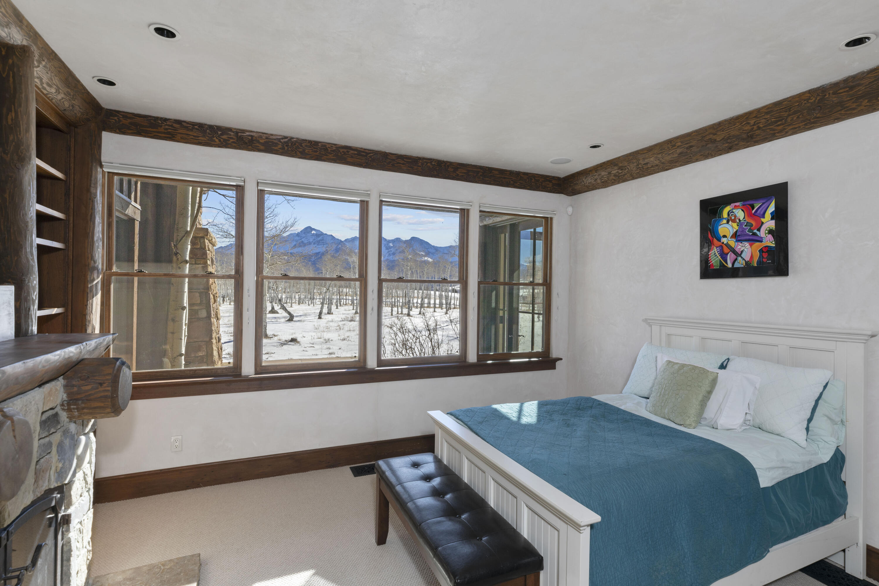 1925 East Anderson Road Placerville, CO 81430 - Photo 14 of 40 a bedroom with a bed and a large window