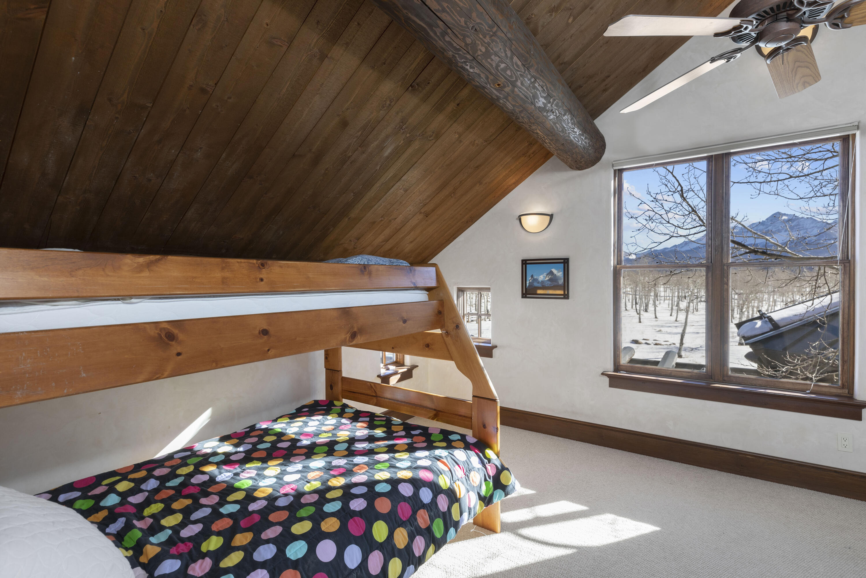1925 East Anderson Road Placerville, CO 81430 - Photo 16 of 40 a bedroom with bed and a large window