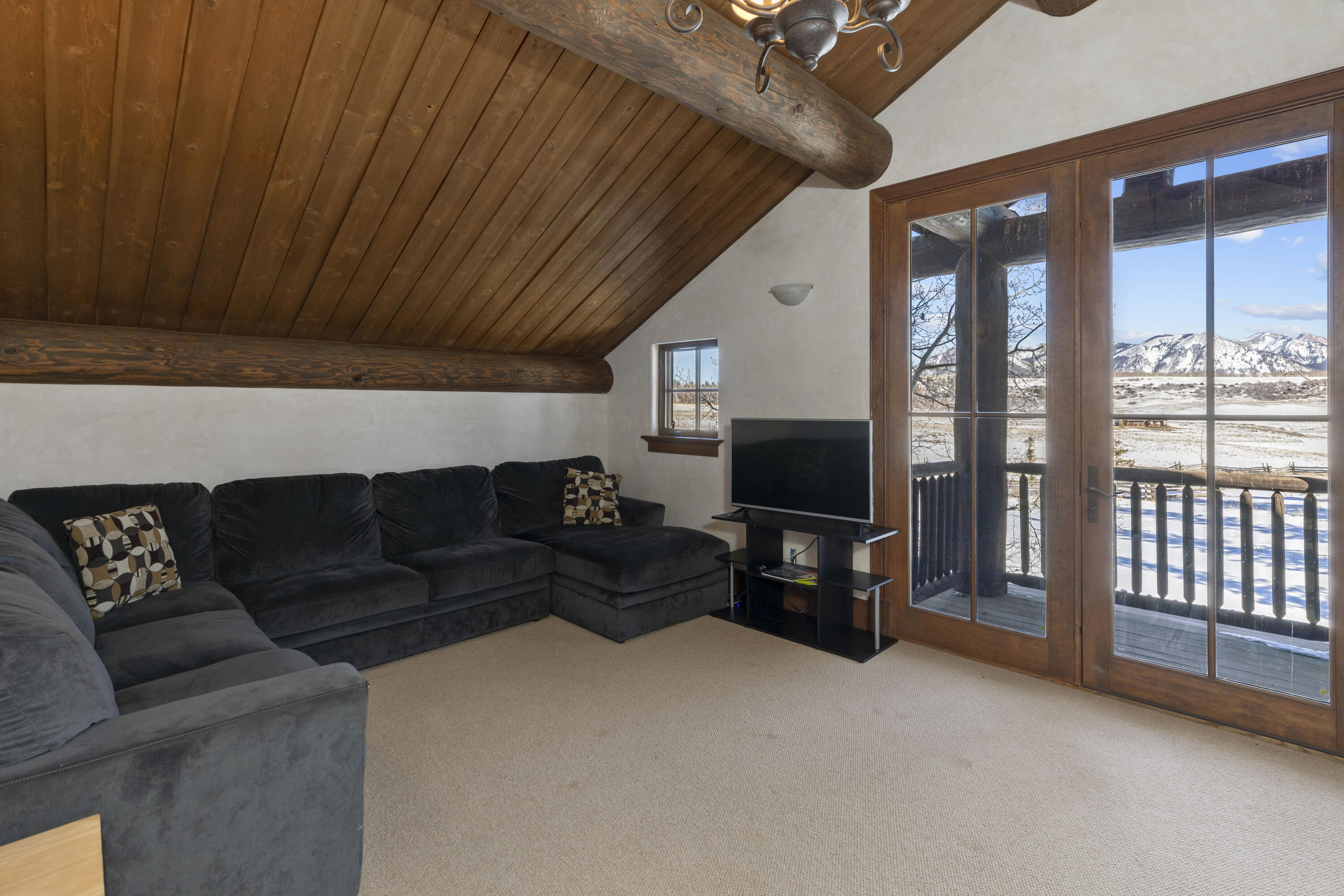 1925 East Anderson Road Placerville, CO 81430 - Photo 27 of 40 a living room with furniture and a flat screen tv