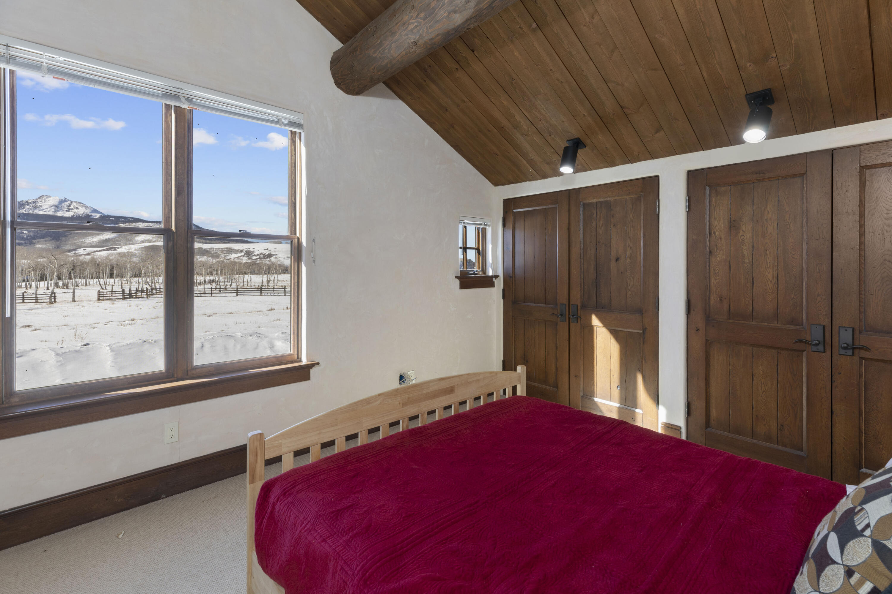 1925 East Anderson Road Placerville, CO 81430 - Photo 28 of 40 a bed room with a bed and wooden floor