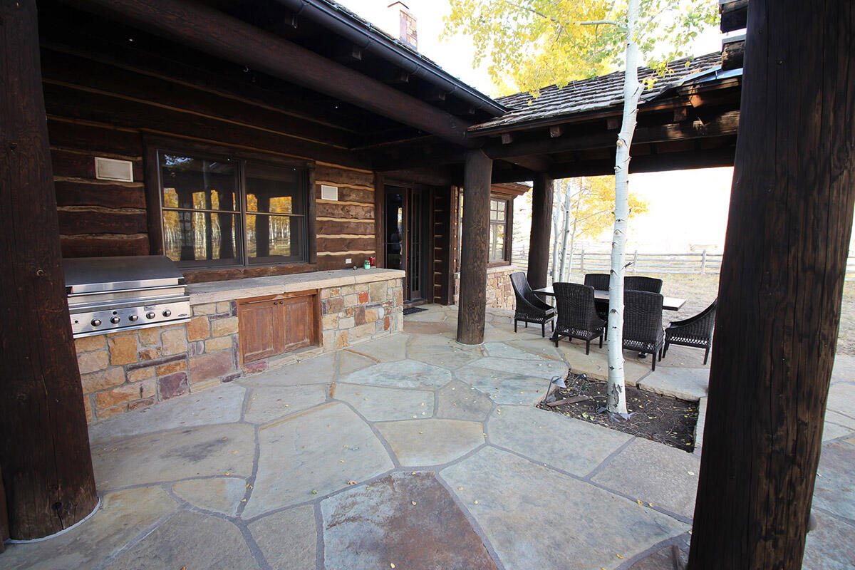 1925 East Anderson Road Placerville, CO 81430 - Photo 33 of 40 a view of a chairs and table in the patio