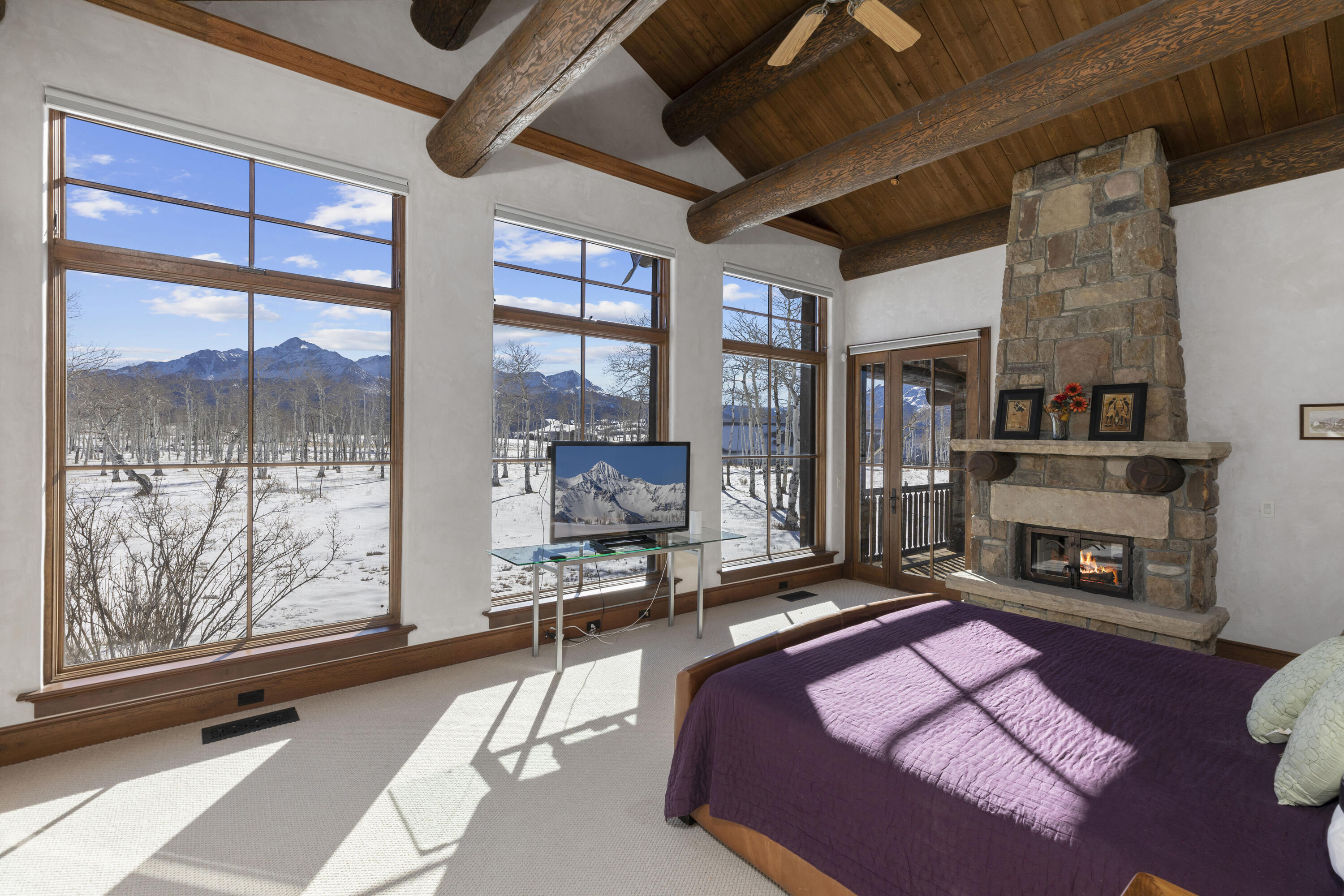 1925 East Anderson Road Placerville, CO 81430 - Photo 10 of 40 a living room with furniture fireplace and a floor to ceiling window