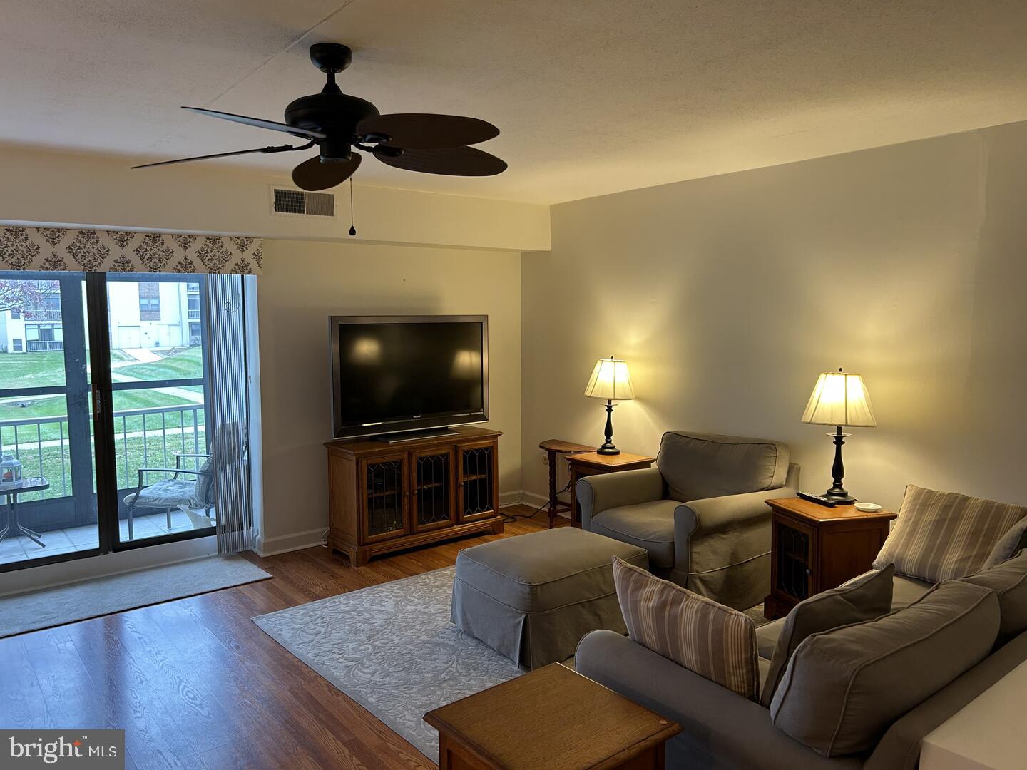68 Welsh Tract Road, Unit D106 Newark, DE 19713 - Photo 4 of 10 a living room with furniture and a flat screen tv