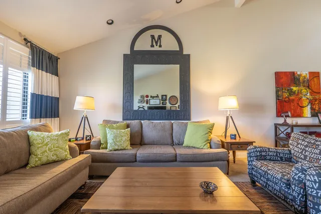 a bedroom with a large bed and a tv