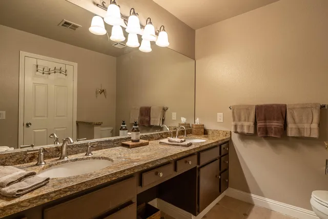 a bath room with a sink and a mirror