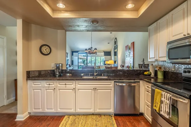 a hallway with a large closet and wooden floor