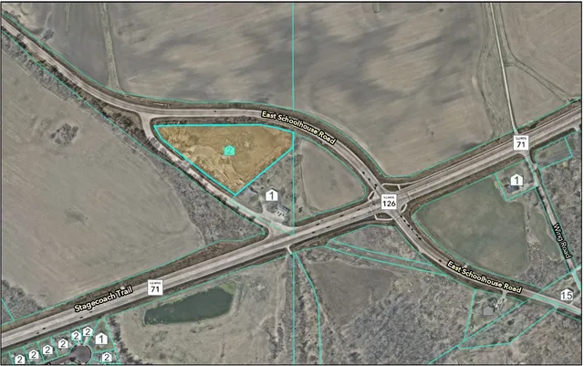 an empty room with a tub and mirror