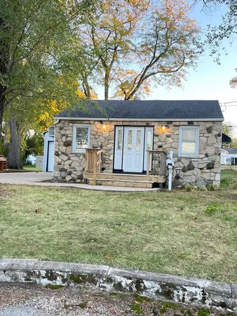 a front view of a house with garden