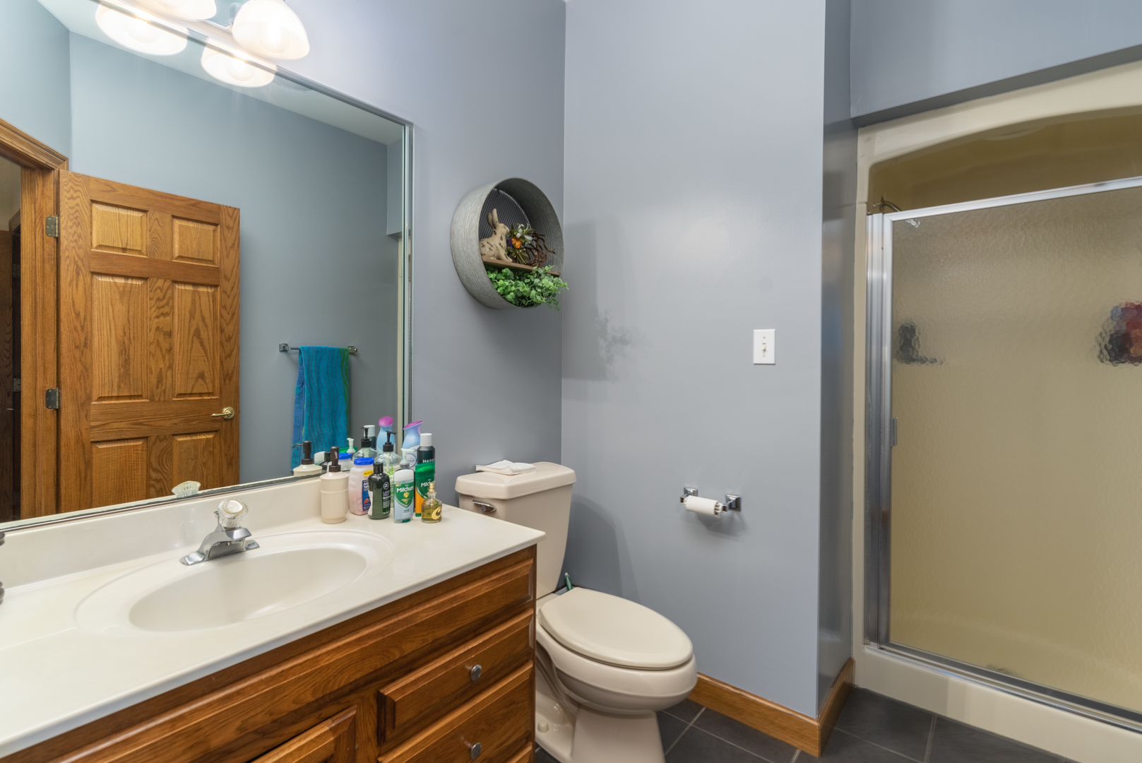 3142 East 1st Road Peru, IL 61354 - Photo 72 of 106 a bathroom with a granite countertop toilet sink and mirror