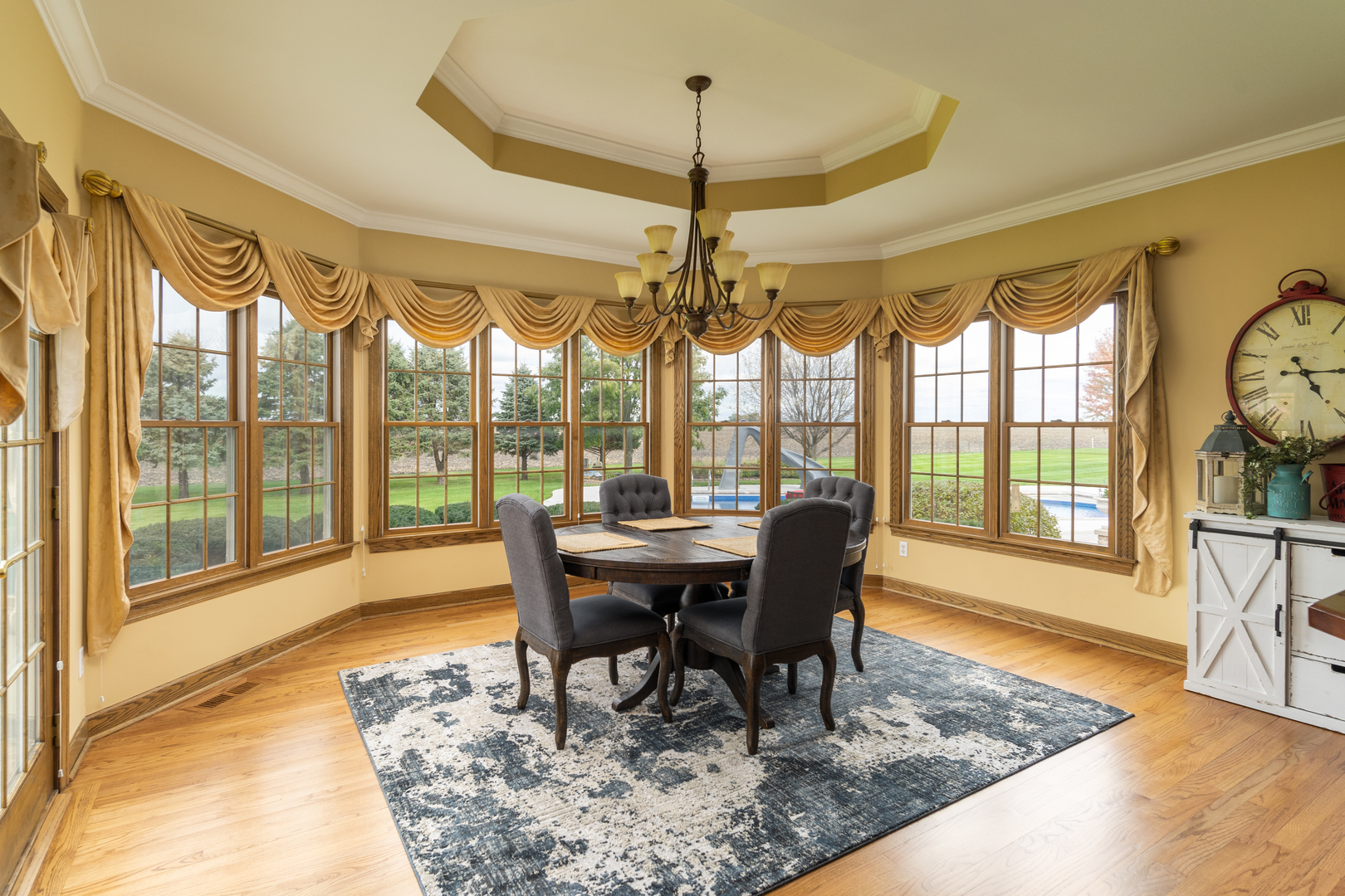 3142 East 1st Road Peru, IL 61354 - Photo 77 of 106 a dining room with furniture a chandelier and wooden floor