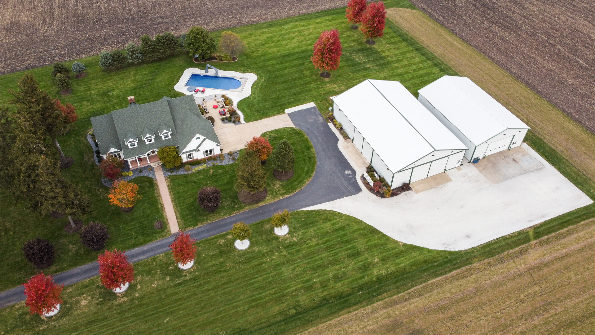 3142 East 1st Road Peru, IL 61354 - Photo 10 of 106 an aerial view of a house with pool yard and outdoor seating