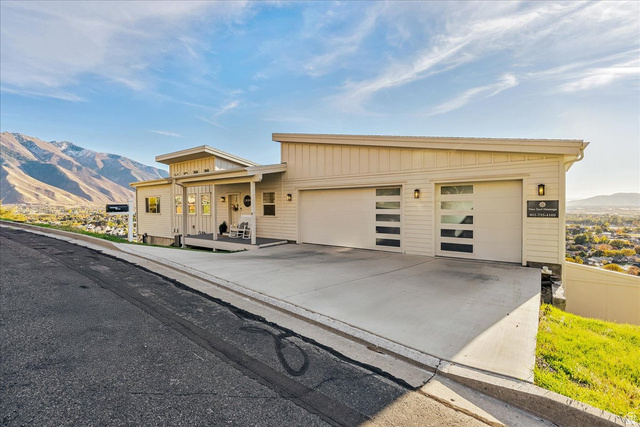 1800 Spring Oaks Drive Springville, UT 84663 - Photo 11 of 68 View of front of house with a mountain view, driveway, an attached garage, and board and batten siding
