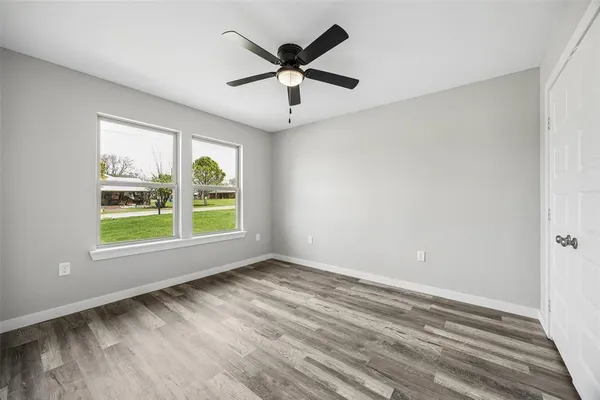 a view of room with window and ceiling fan