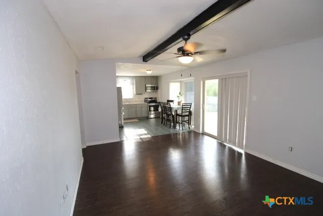 a view of dining room with furniture and wooden floor