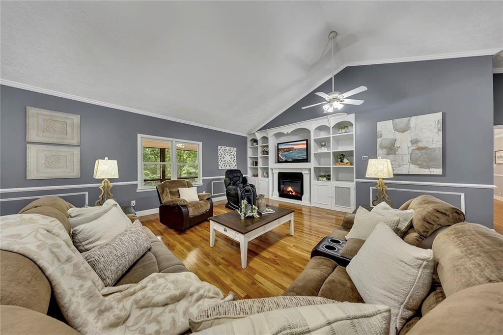 399 Smith Road Ball Ground, GA 30107 - Photo 11 of 63 a living room with furniture and a large window