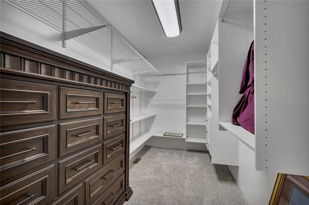 399 Smith Road Ball Ground, GA 30107 - Photo 26 of 63 a view of an empty walk in closet
