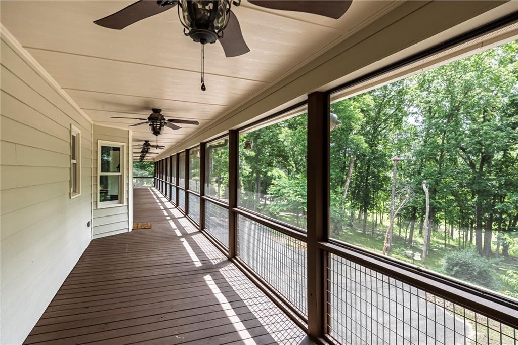 399 Smith Road Ball Ground, GA 30107 - Photo 46 of 63 a view of a balcony with wooden floor