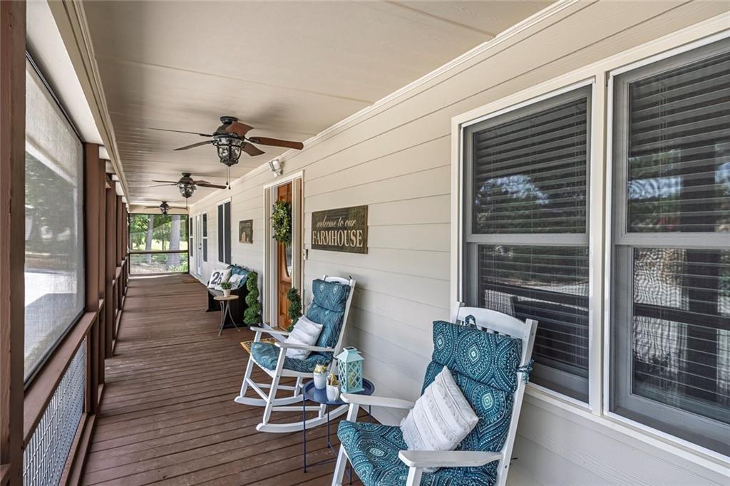 399 Smith Road Ball Ground, GA 30107 - Photo 6 of 63 a view of a porch with furniture and a window