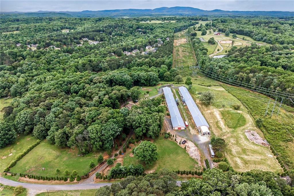 399 Smith Road Ball Ground, GA 30107 - Photo 63 of 63 an aerial view of residential houses with outdoor space and trees