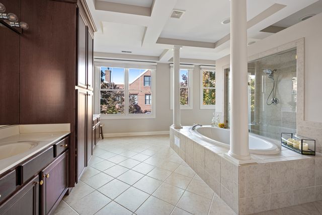 a spacious bathroom with a granite countertop tub sink and mirror