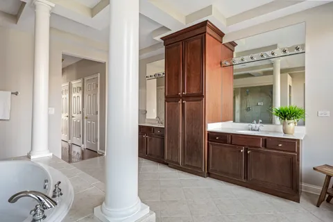a bathroom with a double vanity sink and a mirror