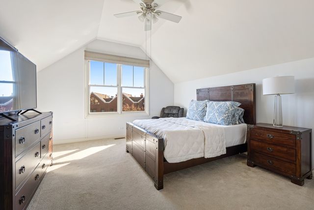 a bedroom with a bed dresser and a window