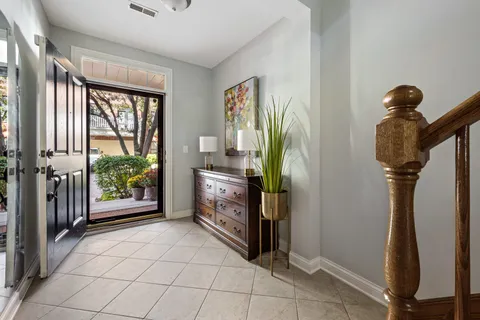 a view of hallway with window and furniture