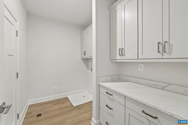 a view of cabinets and wooden floor