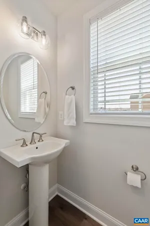 a large white kitchen with a large window