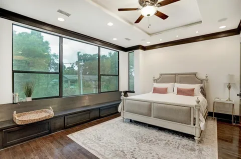 a bedroom with a bed and window