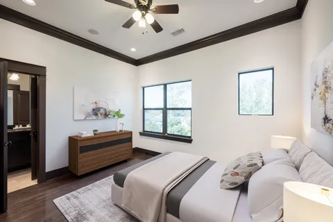 a bedroom with a bed couch and window