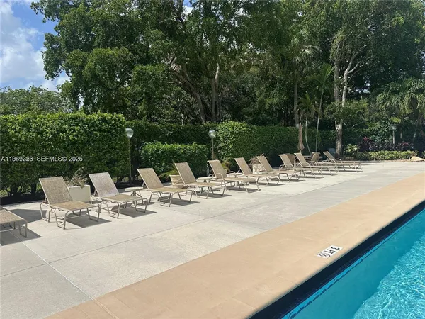 a view of a swimming pool with a patio