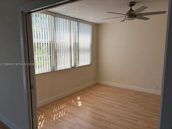 a view of an empty room with a window
