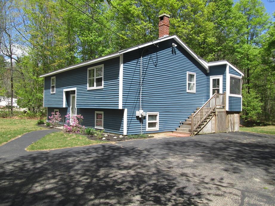 62 North Raymond Road Gray, ME 04039 - Photo 2 of 13 3 season porch wraps around the back...