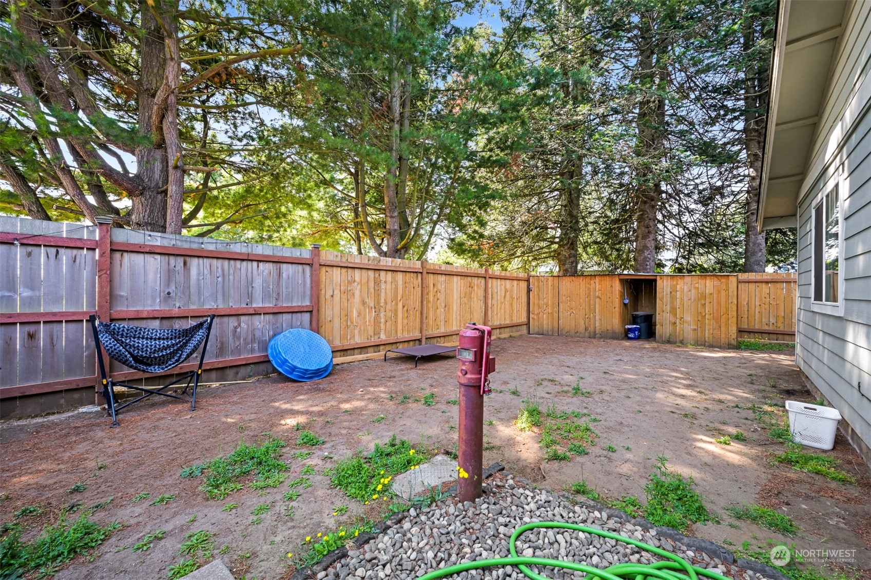 1864 Trigg Road, Unit 14 Ferndale, WA 98248 - Photo 16 of 26 a view of a backyard with chairs and a fire pit