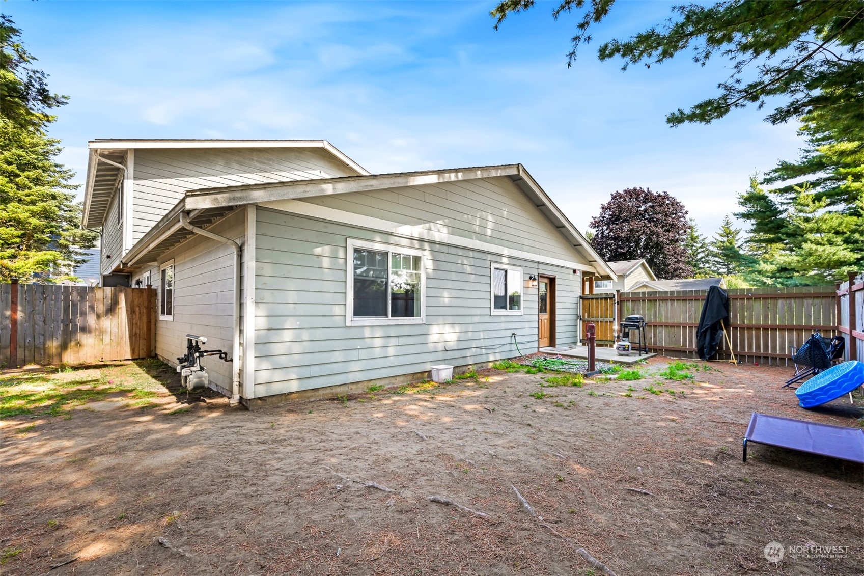 1864 Trigg Road, Unit 14 Ferndale, WA 98248 - Photo 18 of 26 a backyard of a house with barbeque oven table and chairs