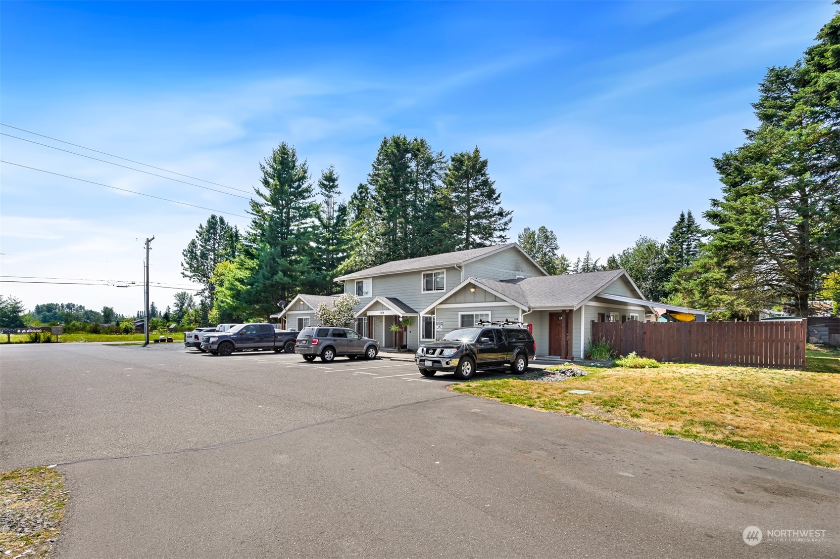 1864 Trigg Road, Unit 14 Ferndale, WA 98248 - Photo 21 of 26 a view of a house with cars parked in front of it