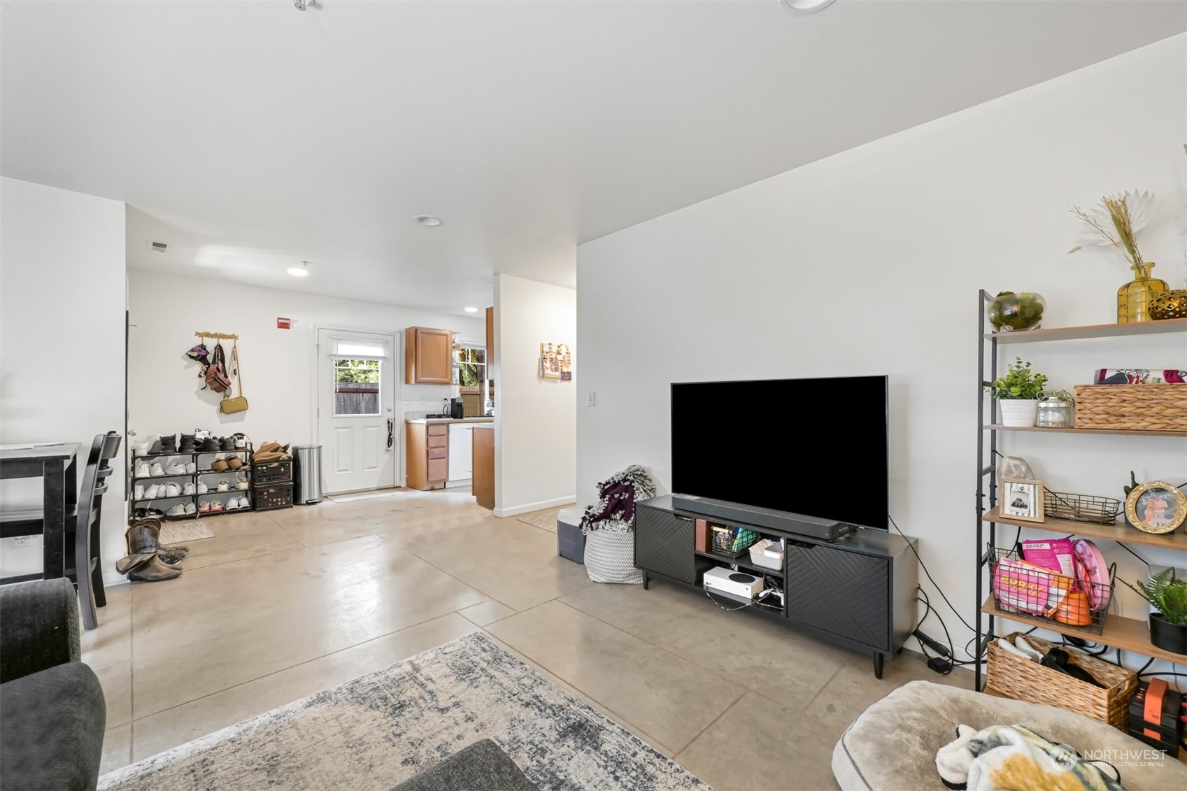 1864 Trigg Road, Unit 14 Ferndale, WA 98248 - Photo 8 of 26 a living room with furniture and a flat screen tv