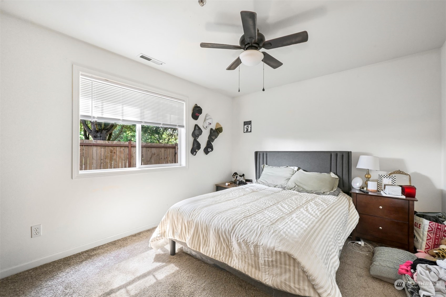 1864 Trigg Road, Unit 14 Ferndale, WA 98248 - Photo 10 of 26 a bedroom with a bed and a chandelier
