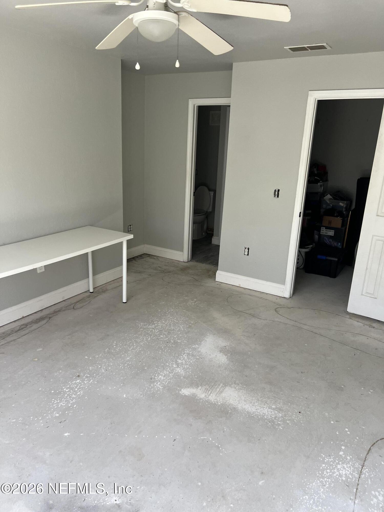 7800 Point Meadows Drive, Unit 835 Jacksonville, FL 32256 - Photo 7 of 13 an empty room with closet