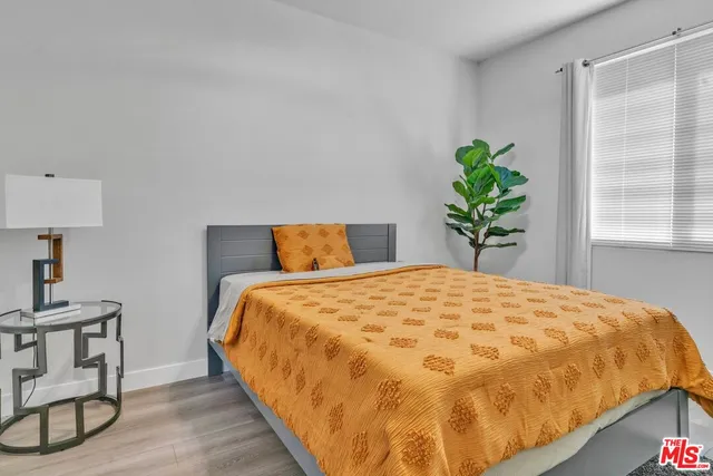 a bedroom with a bed and a table in it