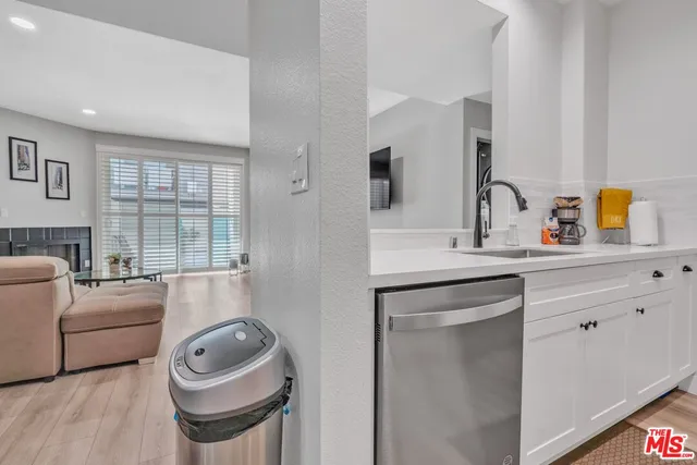 a en suite bathroom with a sink a mirror and a bathtub