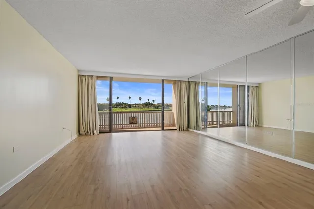 a view of a kitchen with wooden floor