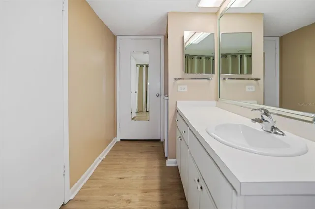 a bathroom with a sink and a mirror