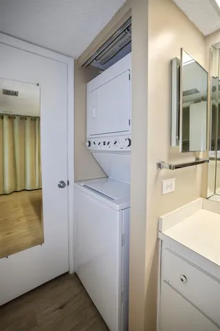 a view of bathroom with a sink and mirror