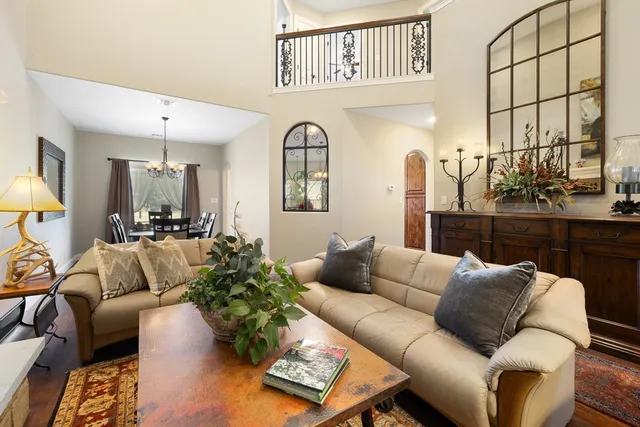 a living room with furniture flowerpot and a window