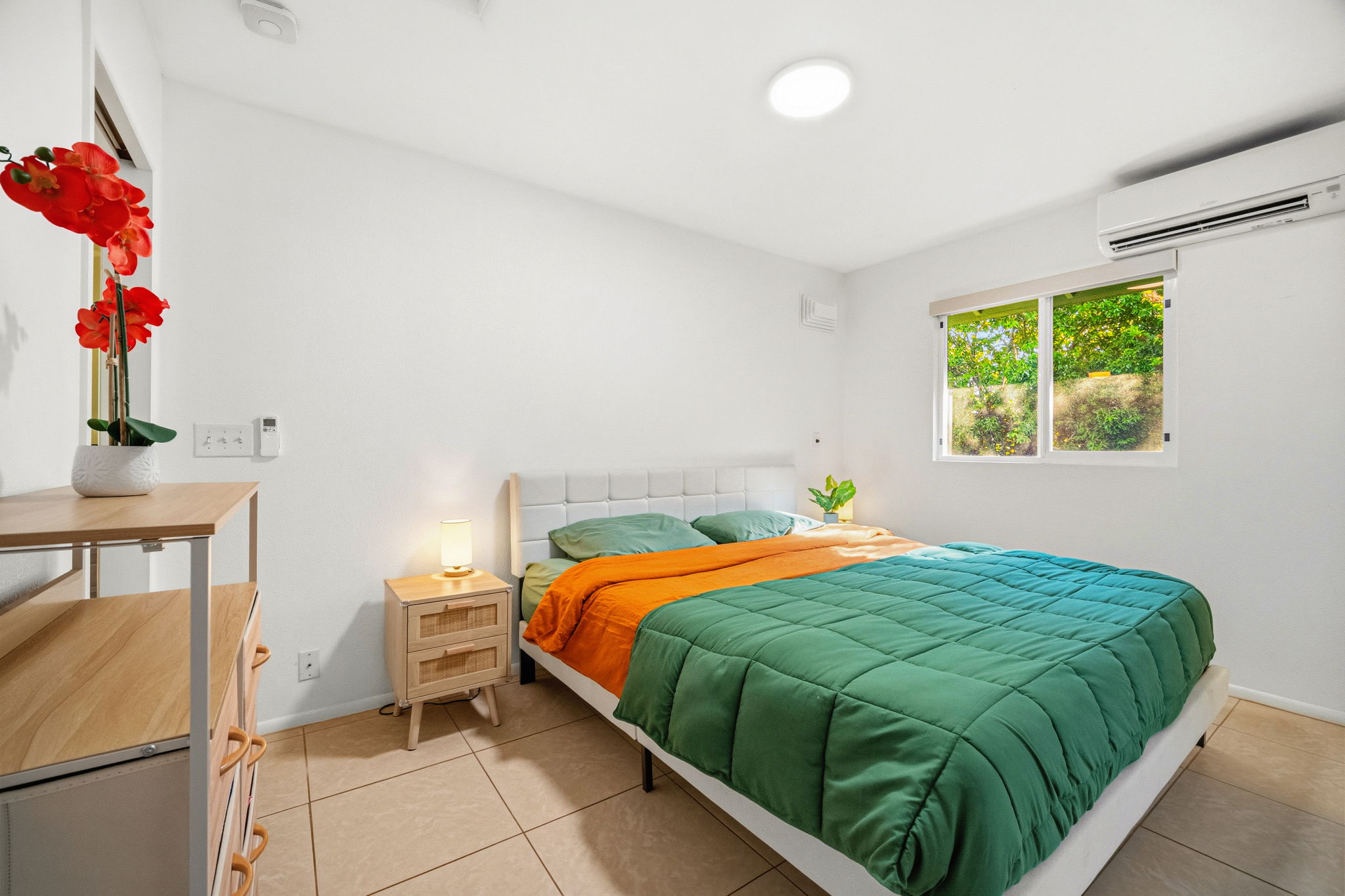 6250 Olohena Road, Unit 2 Kapaa, HI 96746 - Photo 11 of 29 a bedroom with a bed and a window